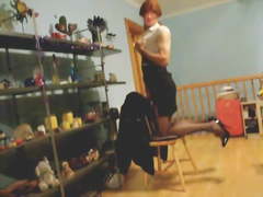 Crossdressing stripping out of secretary outfit