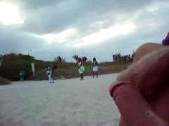 Wanking on the beach in front of black girls
