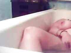 Hidden cam. My horny mum fingering in bath tube