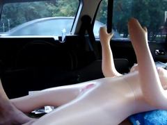 Blow-up doll fun in parking area
