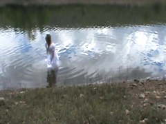 Big wedding gown in a lake